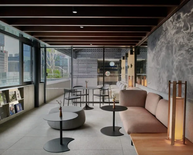 Rooftop lounge with modern seating, city views and relaxed outdoor ambience.
