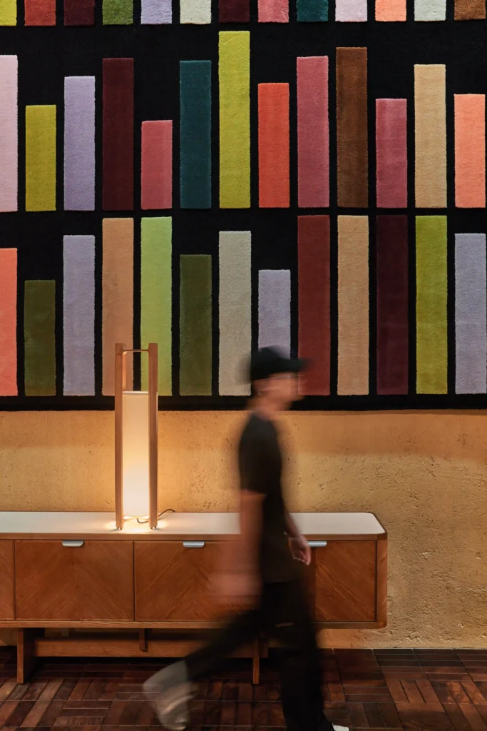 21C-13 21 Carpenter hotel lobby with artwork entitled Readers and Writers Number 1, 2023 by Singaporean artist Heman Chong