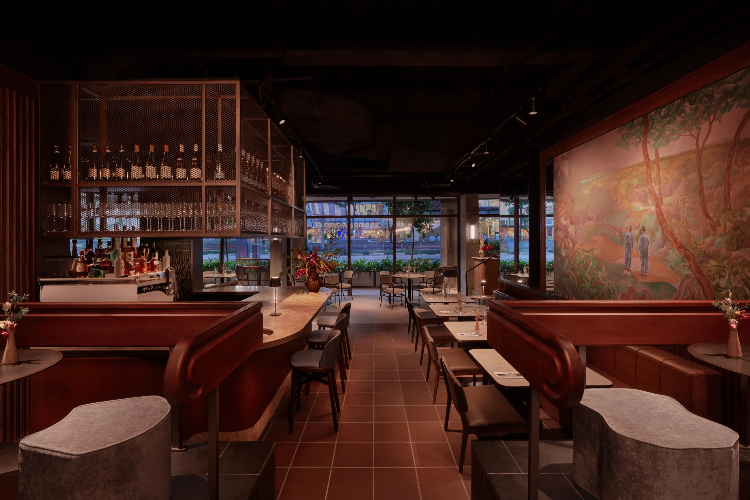 Elegant restaurant bar and dining space with curved wooden counters and large feature artwork.